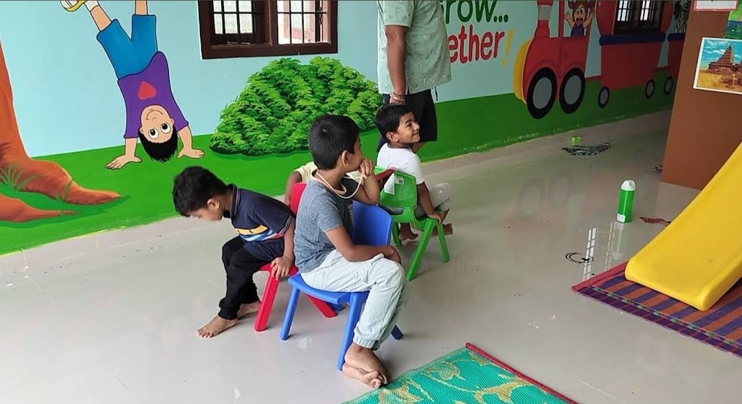Children playing a fun chair game indoors